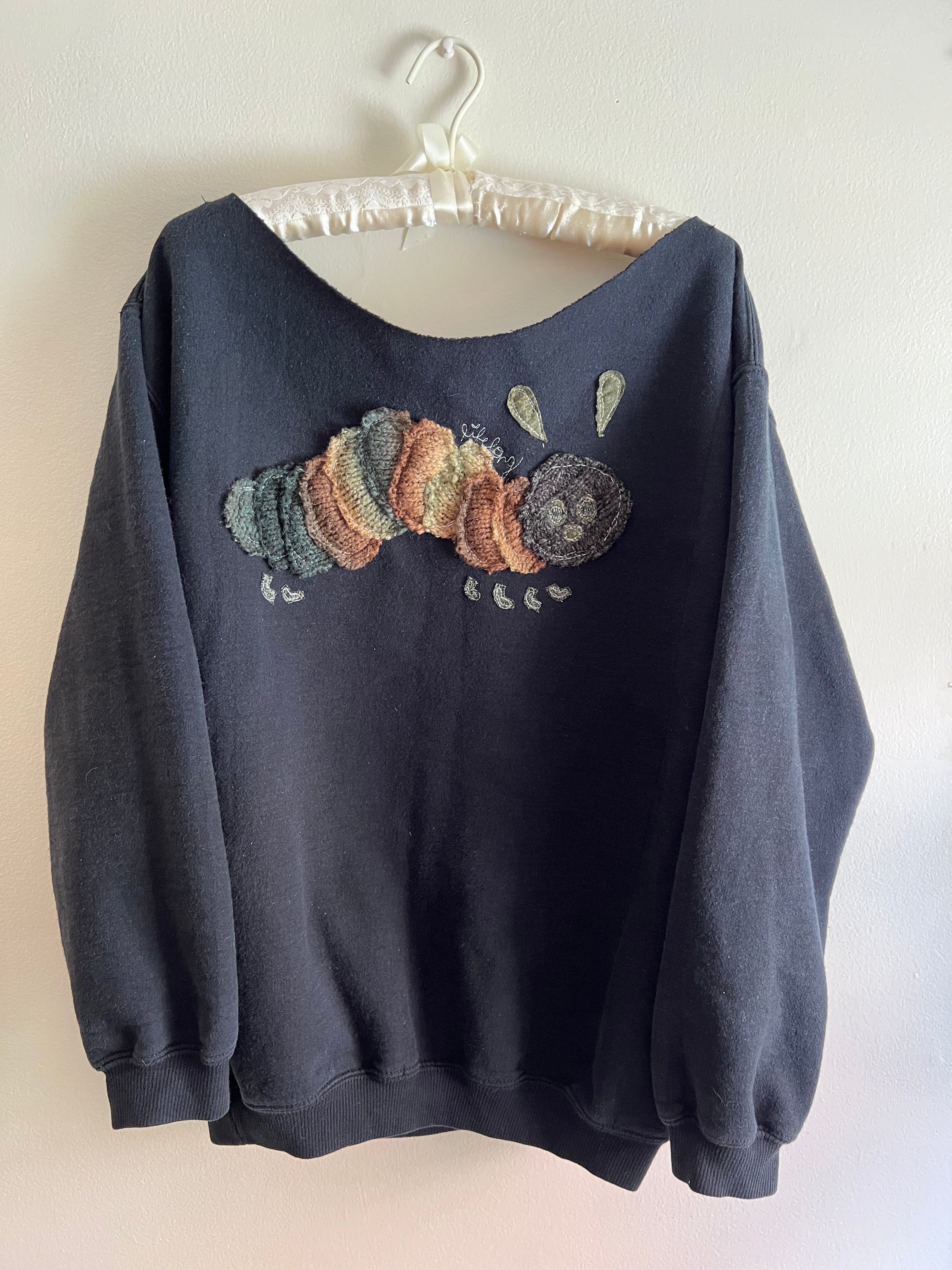 black off-the-shoulder crewneck