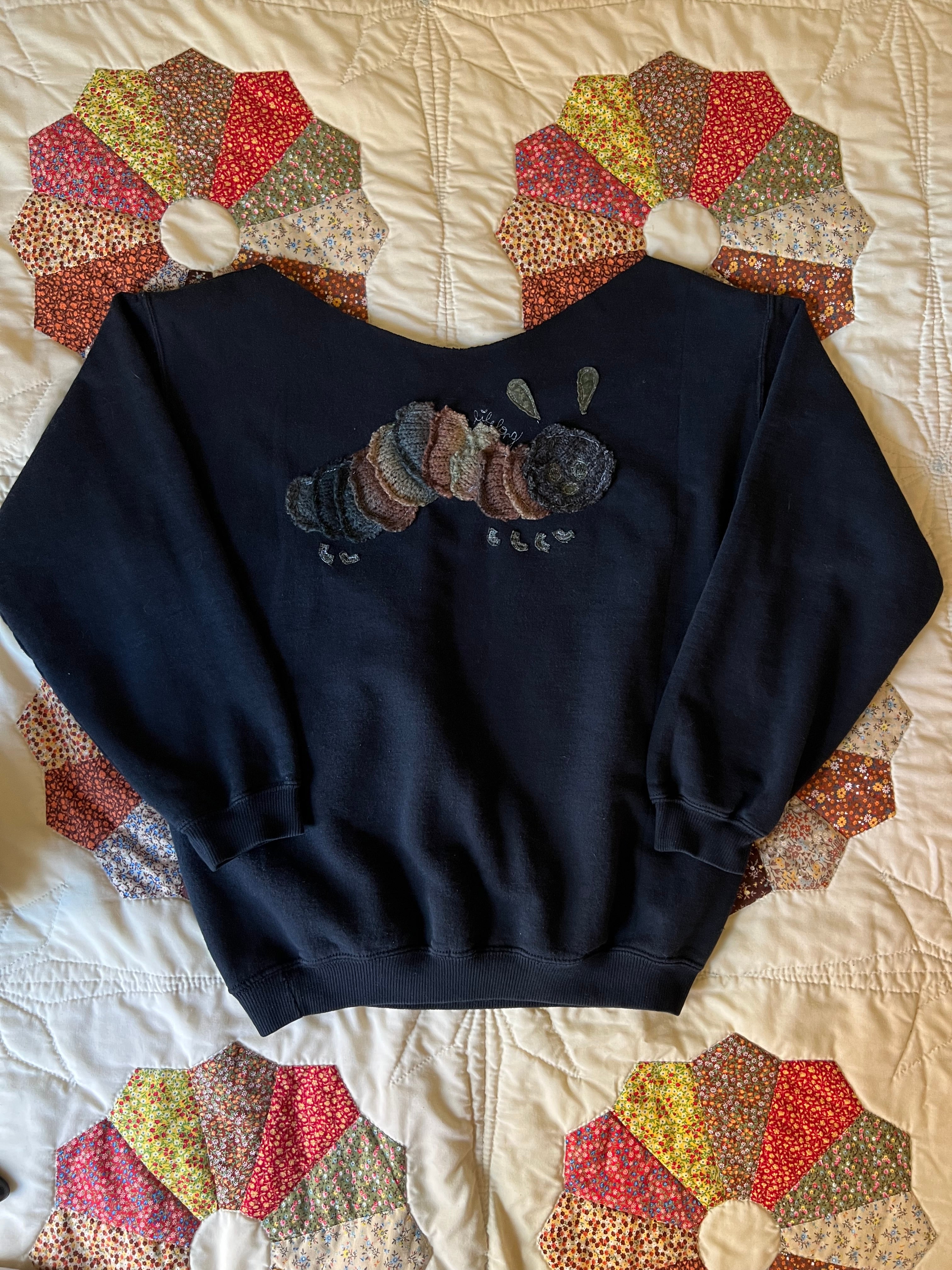 black off-the-shoulder crewneck