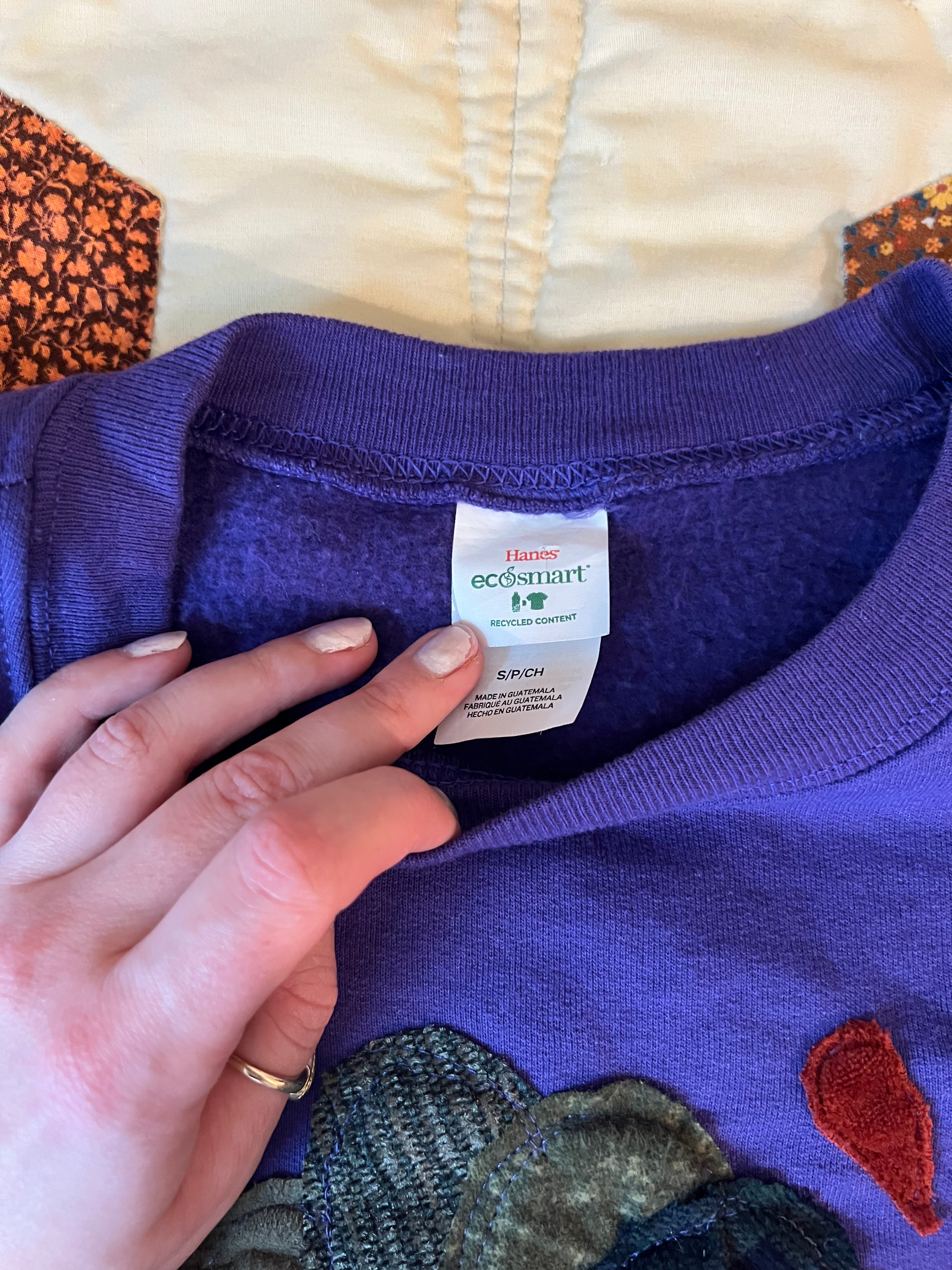 purple crewneck with butterfly