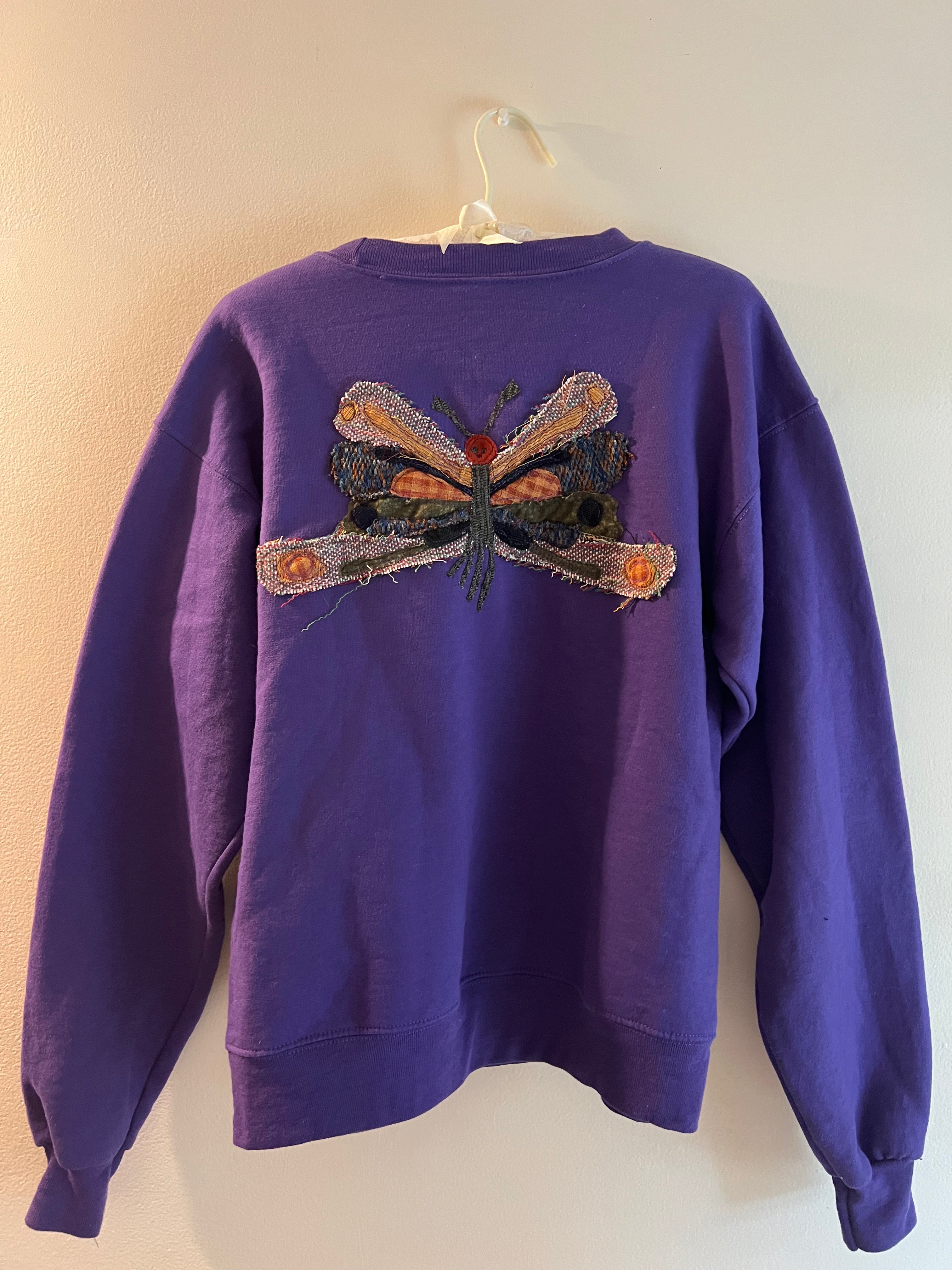 purple crewneck with butterfly