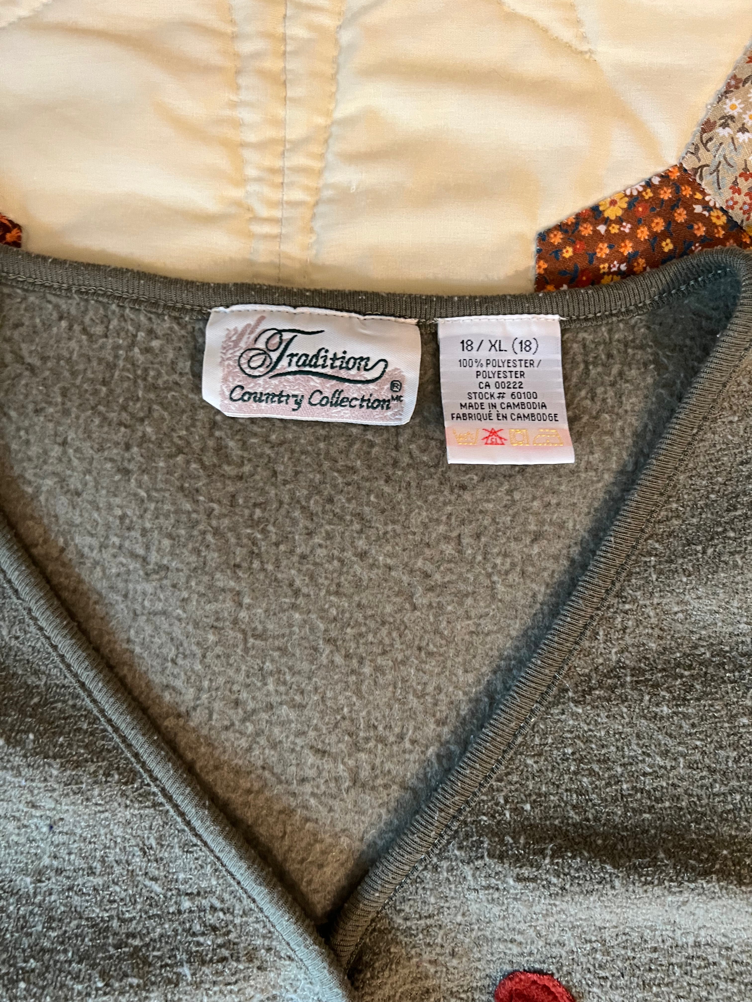 green vest with apples